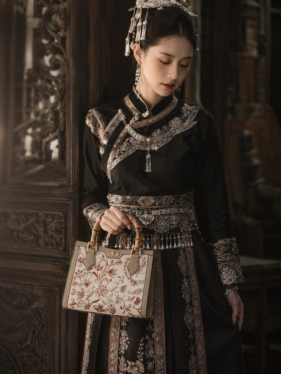 Bamboo Reverie - F01 fully hand-embroidered Mocha Mousse handbag shown handheld on model