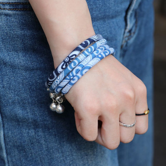 Blue River Bell blue and white Miao-inspired bangle with small bell accents