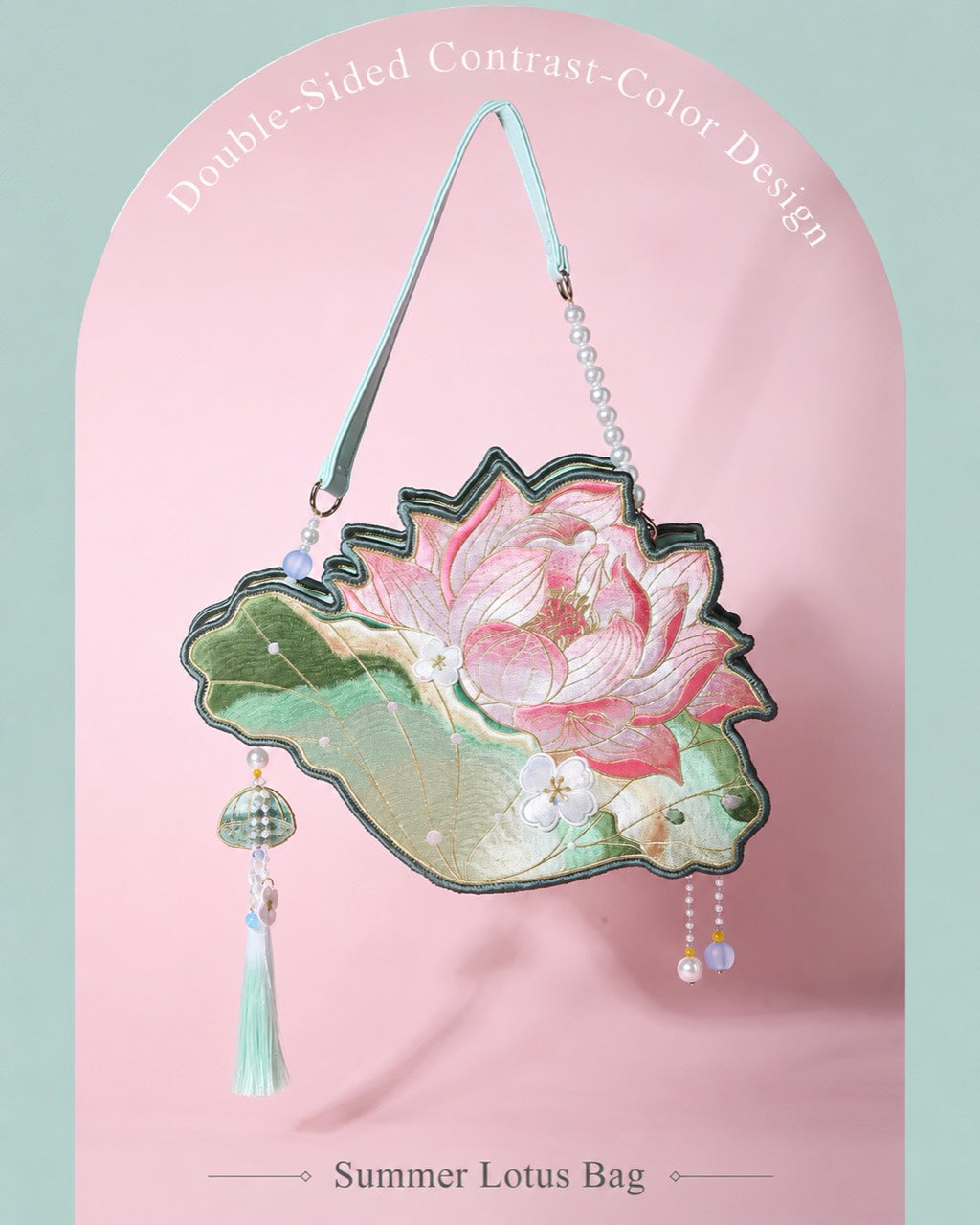 Lotus Whisper pink reverse lotus embroidery bag with green tassel on soft pink backdrop