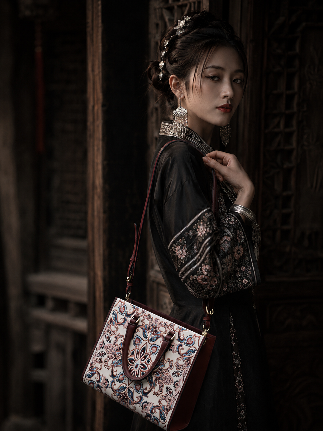 Model carrying the Vermilion Homecoming hand-embroidered tote - E01